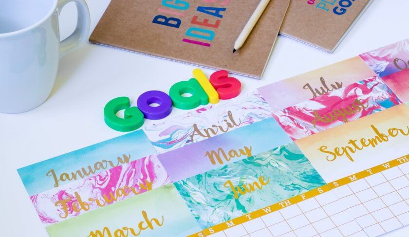 A colorful calendar with goals laid out for the New Year