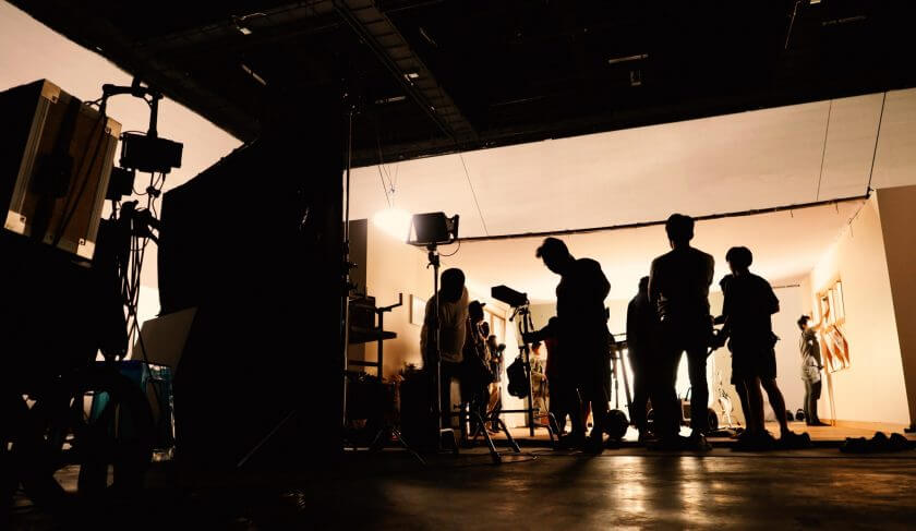 silhoutte-images-of-video-production-and-lighting-set-for-filming-which-movie-crew-team-working