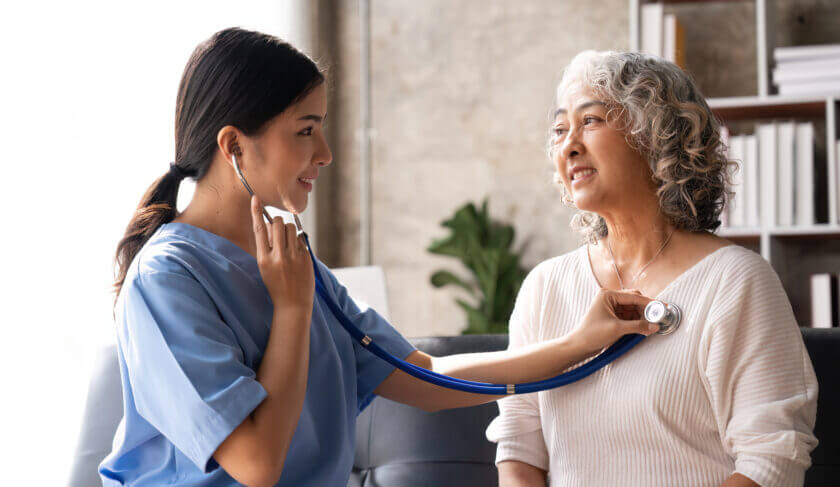 A nurse checks on an elderly patient using a stethoscope. We discuss the careers with the most job security