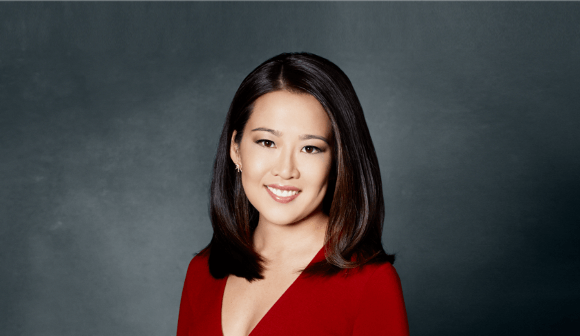 CNBC's Melissa Lee sits at an anchor desk. She discusses her career pivot on the pilot episode of the podcast "How She Does It."